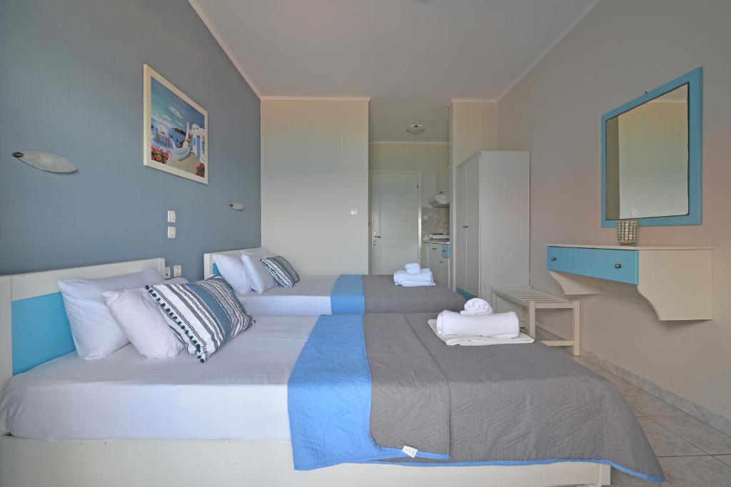 Postel nebo postele na pokoji v ubytování PERASMA ROOMS