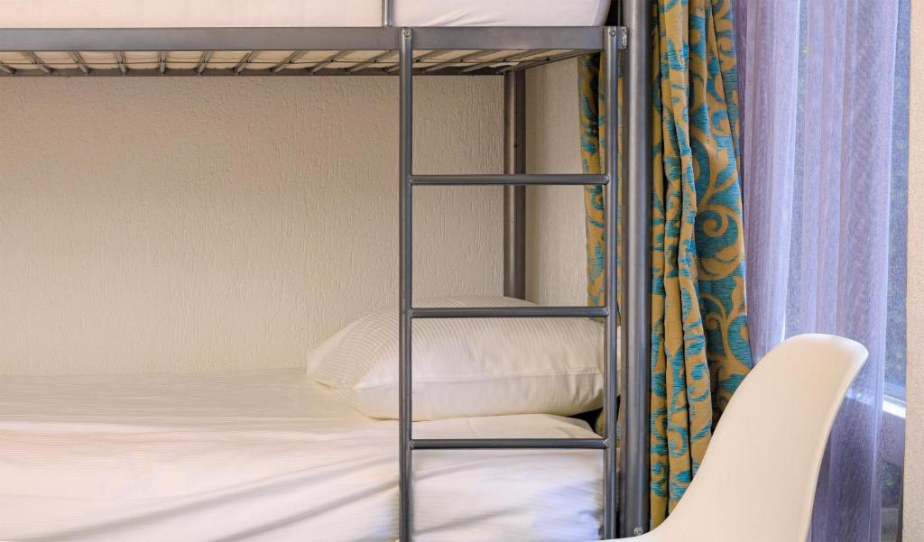 Postel nebo postele na pokoji v ubytování Hotel Berg en Bos