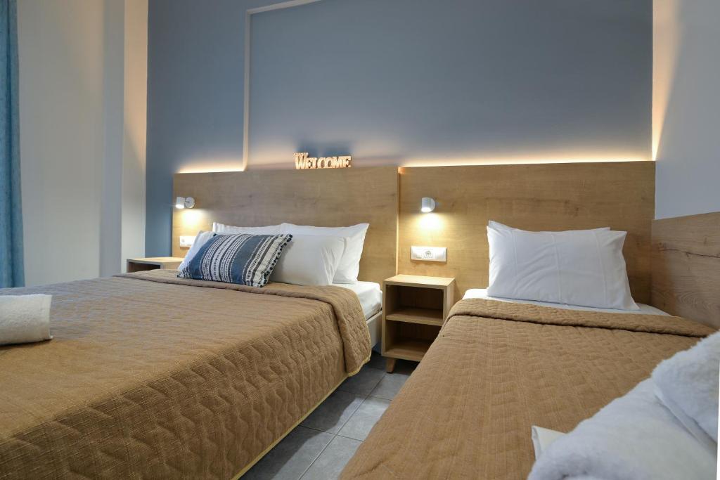 Postel nebo postele na pokoji v ubytování PERASMA ROOMS