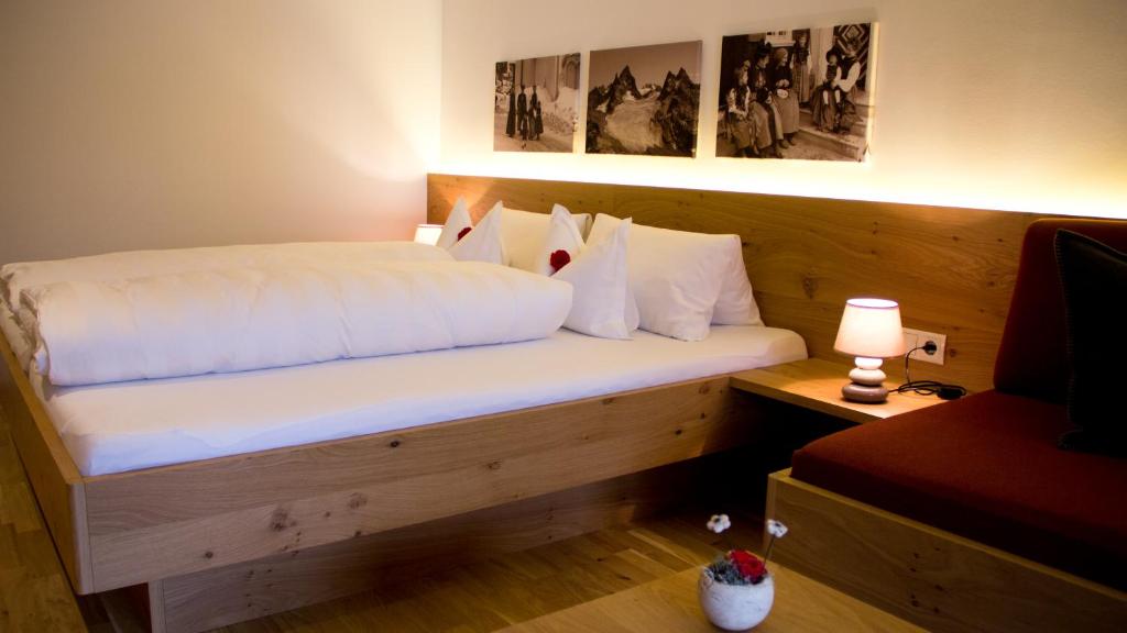 Postel nebo postele na pokoji v ubytování Pension Christophorus Hotel Garni