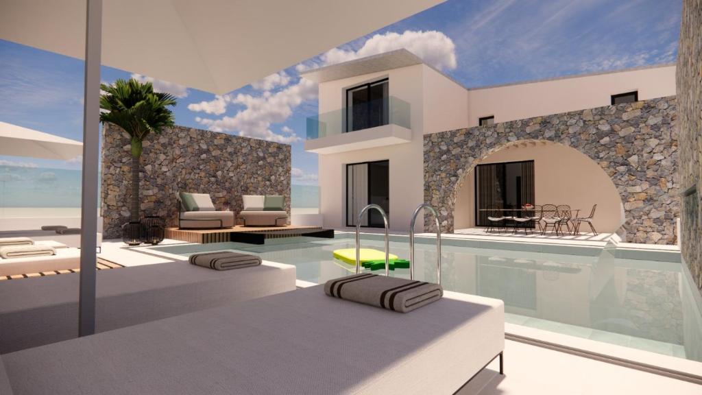 une villa avec une piscine dans l'établissement Kallithea Luxury Villas #4, à Koskinou