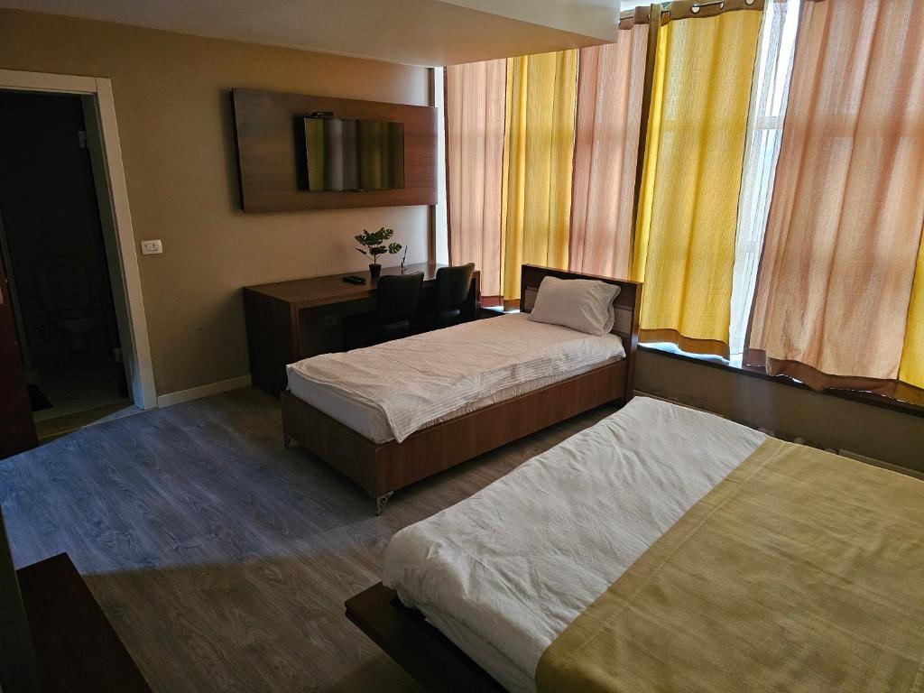 Postel nebo postele na pokoji v ubytování HOTEL BENITA