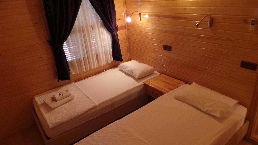 Postel nebo postele na pokoji v ubytování Mercan Bungalow