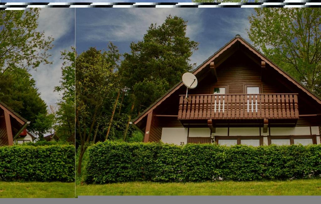 a house with a balcony on the side of it at Ferienhaus 23 In Kirchheim in Kirchheim