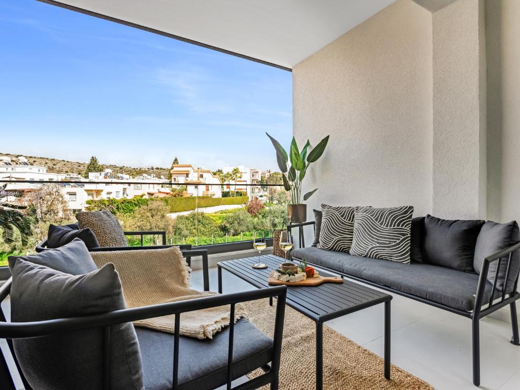 a living room with a couch and a table at Sanders Triple in Limassol