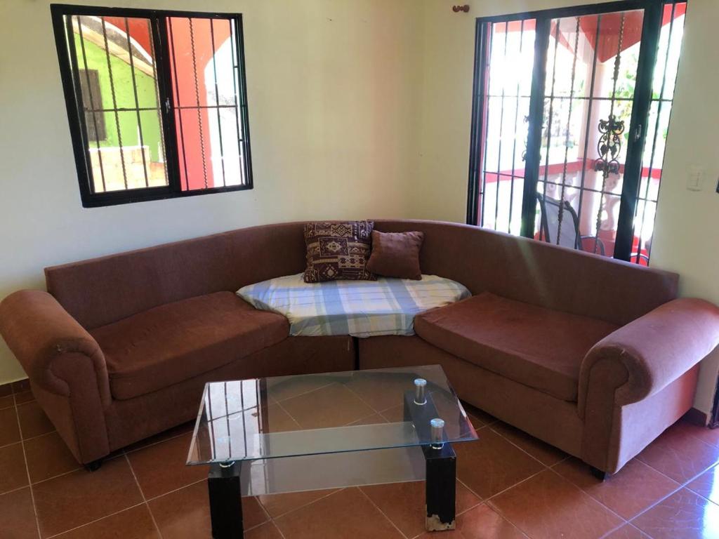 a living room with a couch and a coffee table at Típica casa dominicana in Las Galeras
