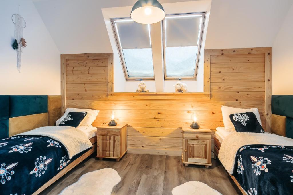 Posteľ alebo postele v izbe v ubytovaní Apartamenty Biatlonowe