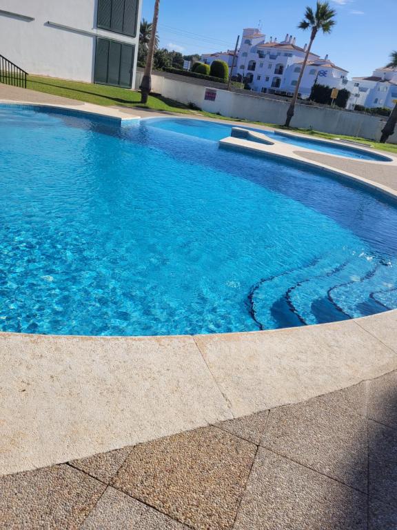 Piscina en o cerca de Cala en Bosc appartamento con piscina