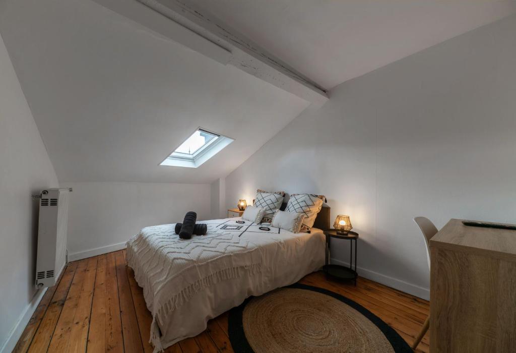 Un ou plusieurs lits dans un hébergement de l'établissement L'Eugène - Maison 3 chambres