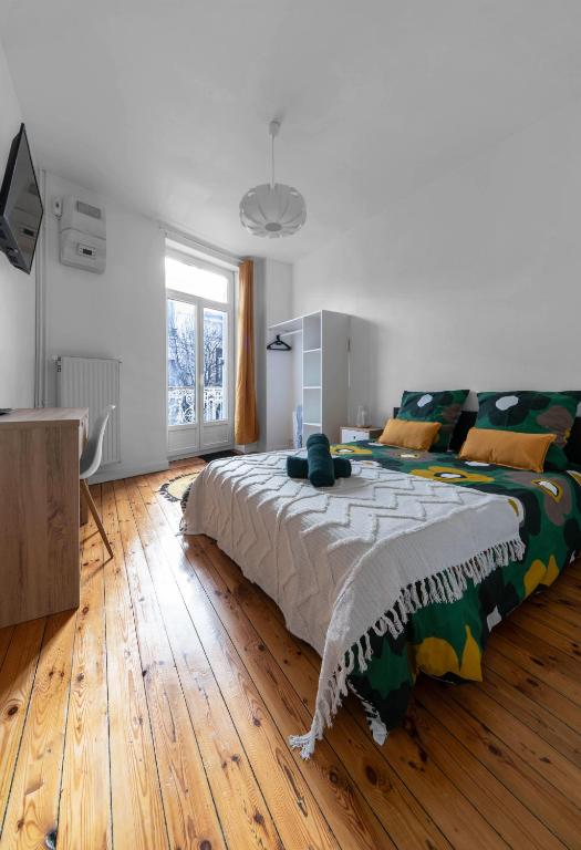Un ou plusieurs lits dans un hébergement de l'établissement L'Eugène - Maison 3 chambres