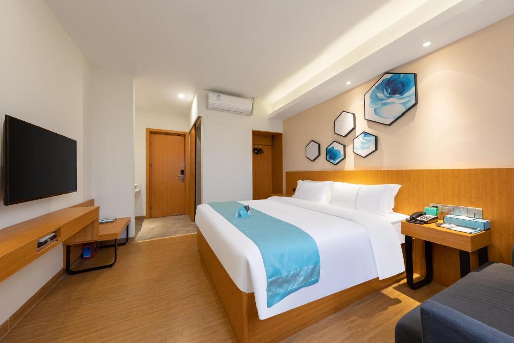 Postel nebo postele na pokoji v ubytování Xana Lite Hotel - Guangzhou Fangcun Huadiwan Metro Station