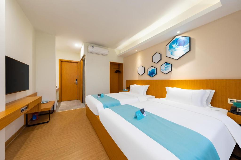 Postel nebo postele na pokoji v ubytování Xana Lite Hotel - Guangzhou Fangcun Huadiwan Metro Station