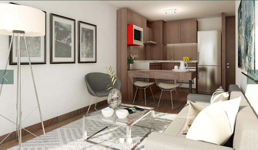 a living room with a couch and a kitchen at Best Apartment Rental Estación Central in Santiago