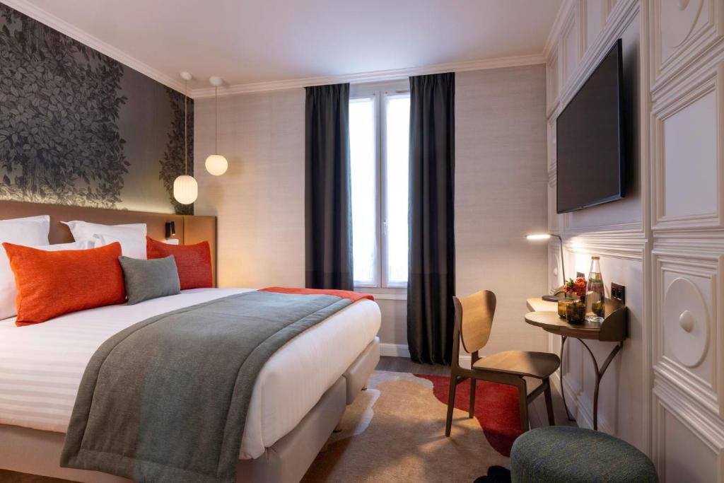 Postel nebo postele na pokoji v ubytování Hôtel L'Ormaie & Spa