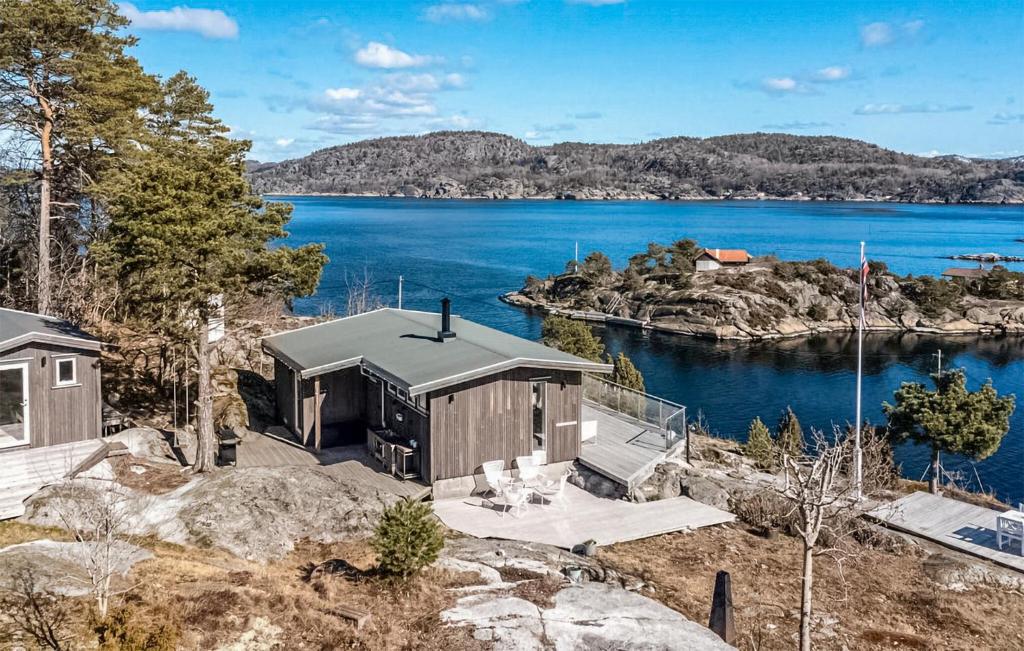 an aerial view of a house next to a body of water at Lovely Home In Helgeroa With Harbor View in Helgeroa