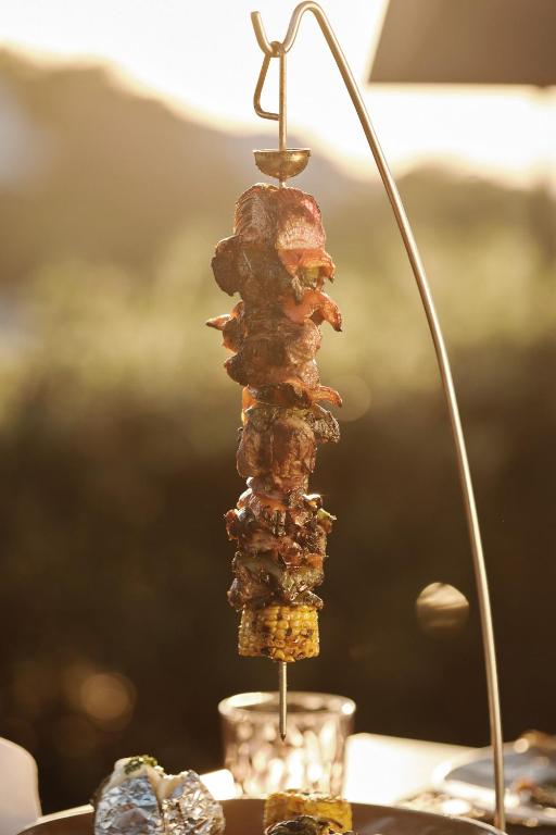 a stack of food on a pole on a table at Prinsotel La Dorada & Spa in Playa de Muro
