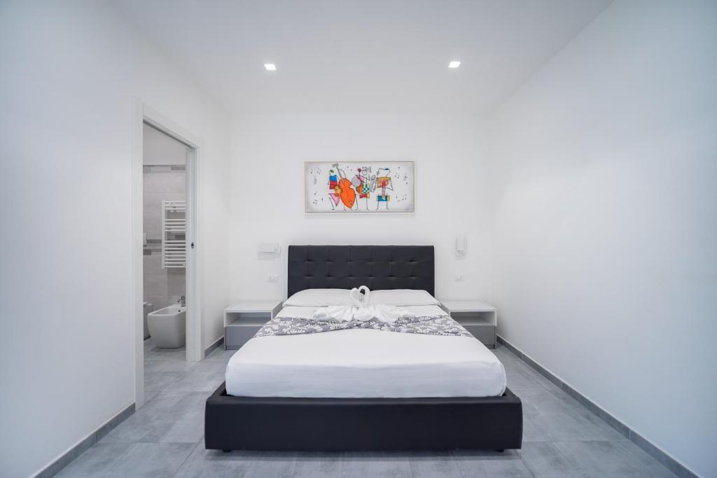 Giường trong phòng chung tại Vincent GUESTHOUSE