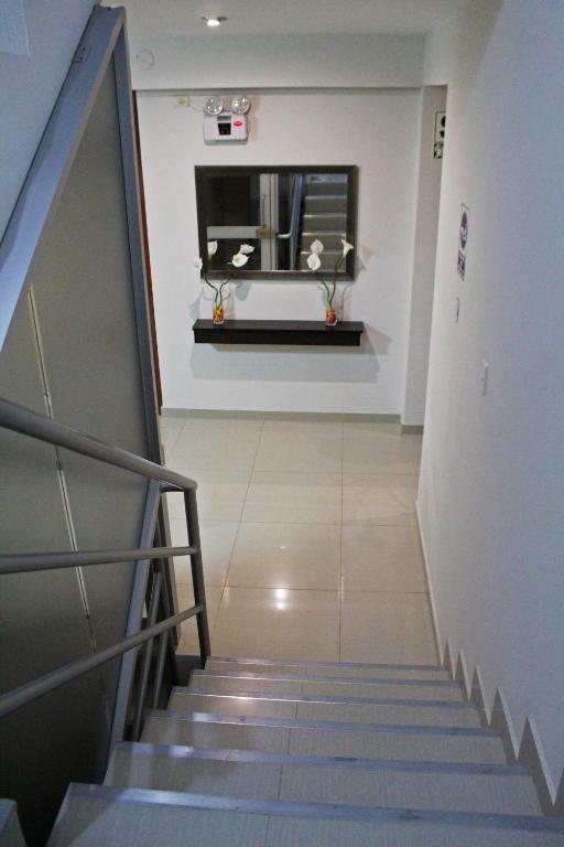 a staircase in a building with a stair case at Hotel Sengor in Urbanizacion Buenos Aires
