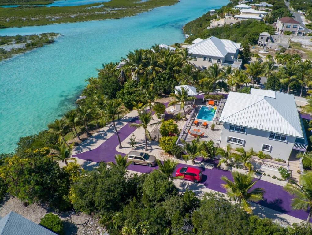 an aerial view of a house and the ocean at NEW Chalk Sound Home BBQ Pool Beach Steps Away in Providenciales