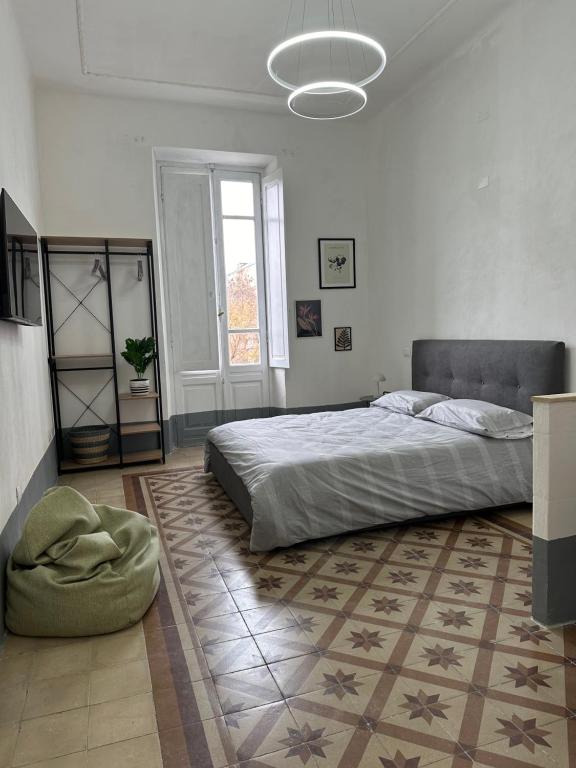 Łóżko lub łóżka w pokoju w obiekcie Palazzo Pilo