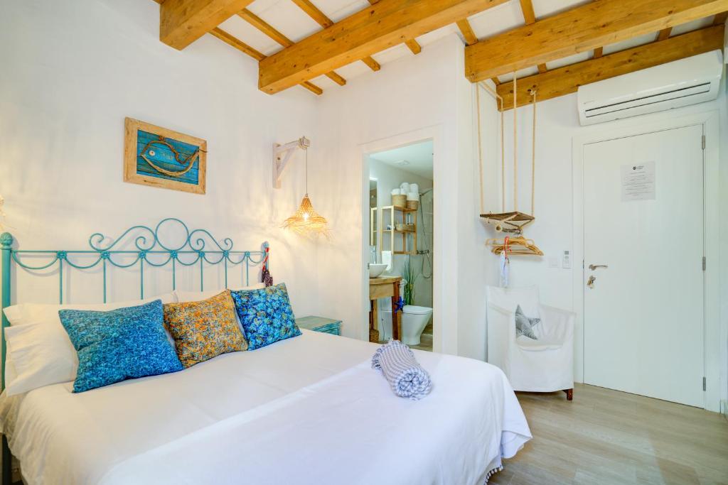 Postel nebo postele na pokoji v ubytování Calma Hotel