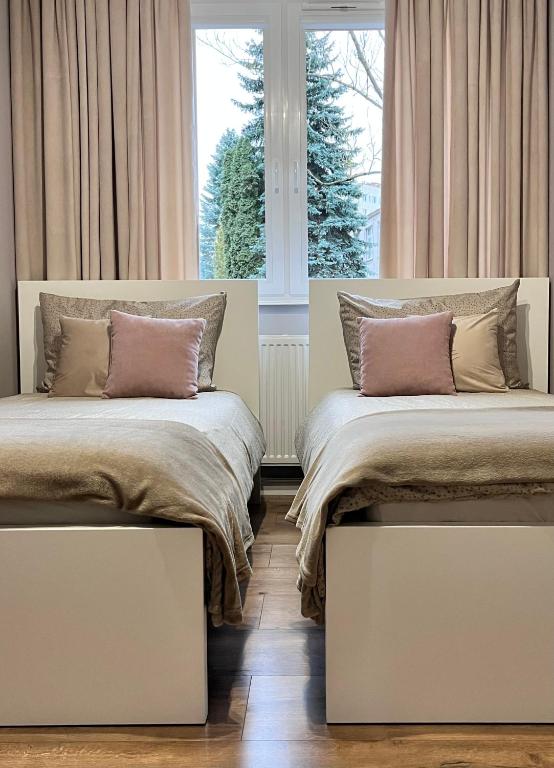 Posteľ alebo postele v izbe v ubytovaní Apartament Przy Obserwatorium&Singielnia