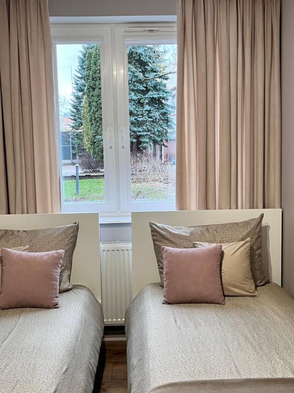 Posteľ alebo postele v izbe v ubytovaní Apartament Przy Obserwatorium&Singielnia