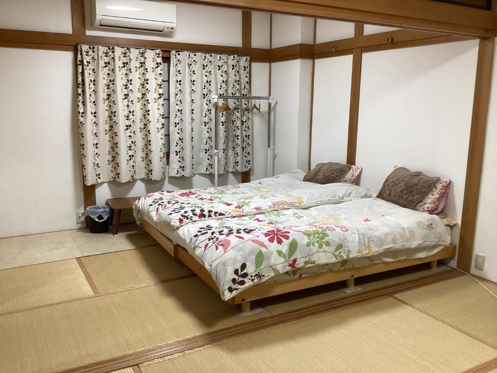 a bedroom with a bed with a canopy at Osaka and house - Vacation STAY 16309 in Osaka