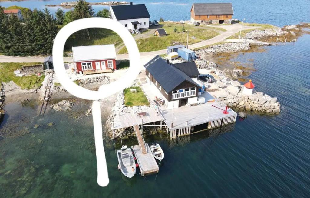 an aerial view of a house on an island in the water at Cabin in Borgvåg Lofoten - Large in Straum