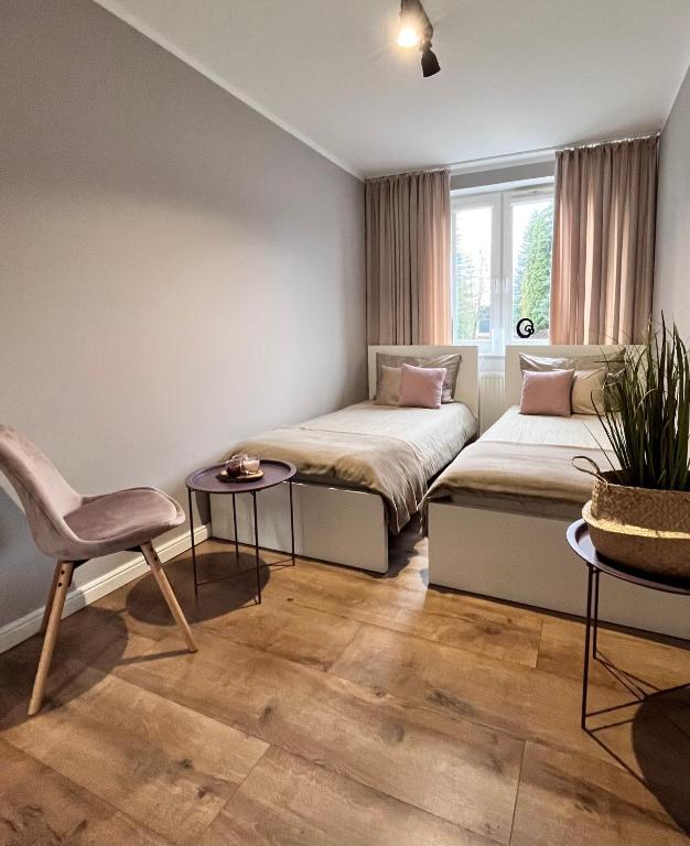 Posteľ alebo postele v izbe v ubytovaní Apartament Przy Obserwatorium&Singielnia