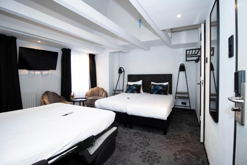 Postel nebo postele na pokoji v ubytování Hotel Pauw