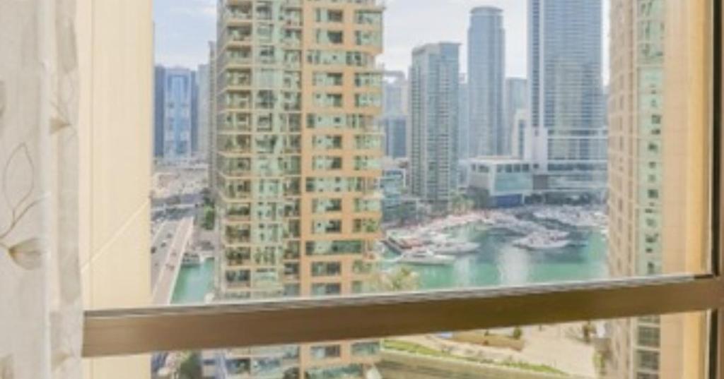 a view of a city skyline from a window at Modern Oasis in Heart of Marina with Marina View - 11AB05 in Dubai