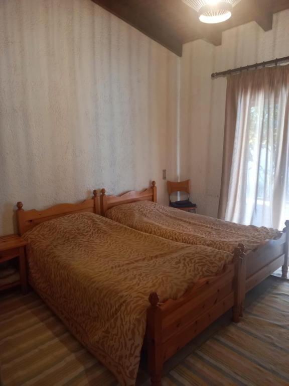 Postel nebo postele na pokoji v ubytování Sunhouse Vrachati