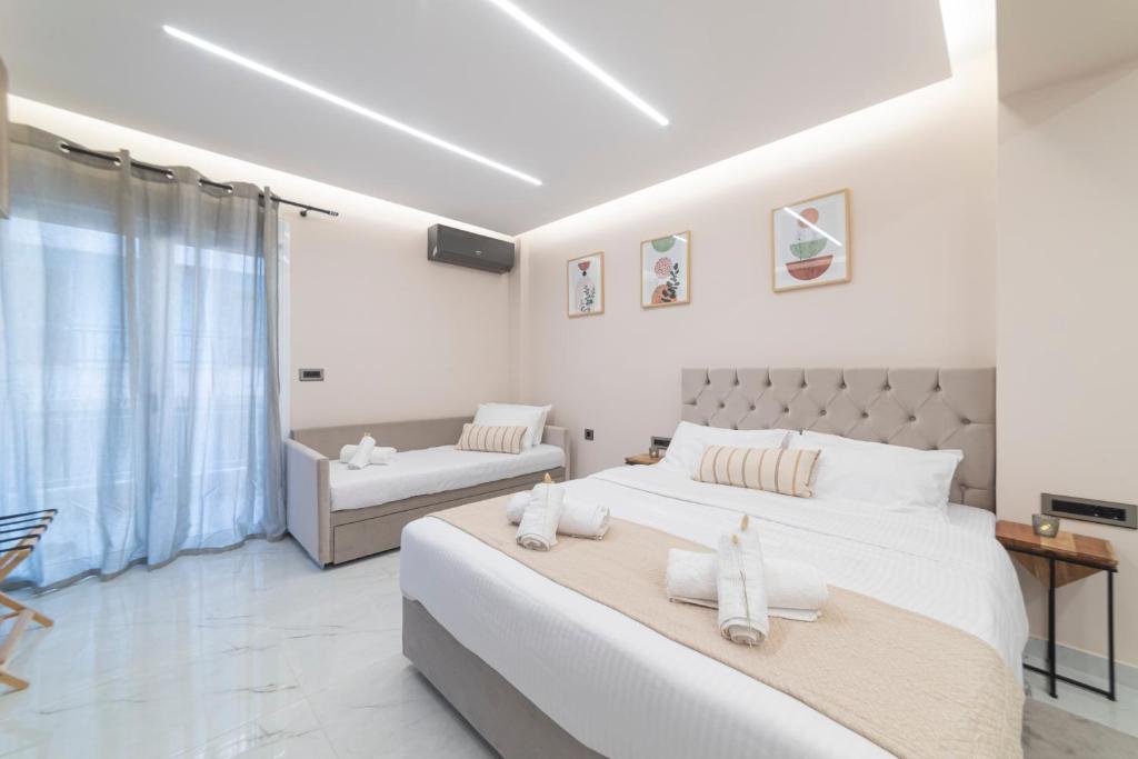 Postel nebo postele na pokoji v ubytování Elite Suite Loutraki