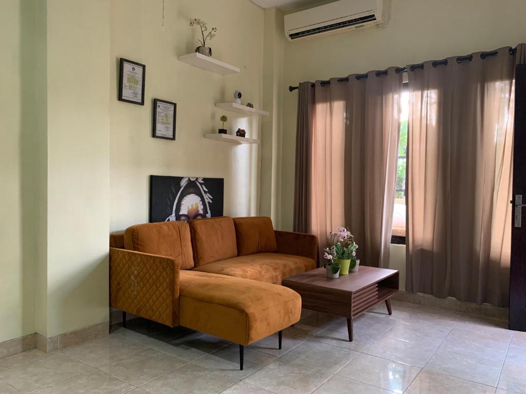 Posezení v ubytování Cozy Palm Villa