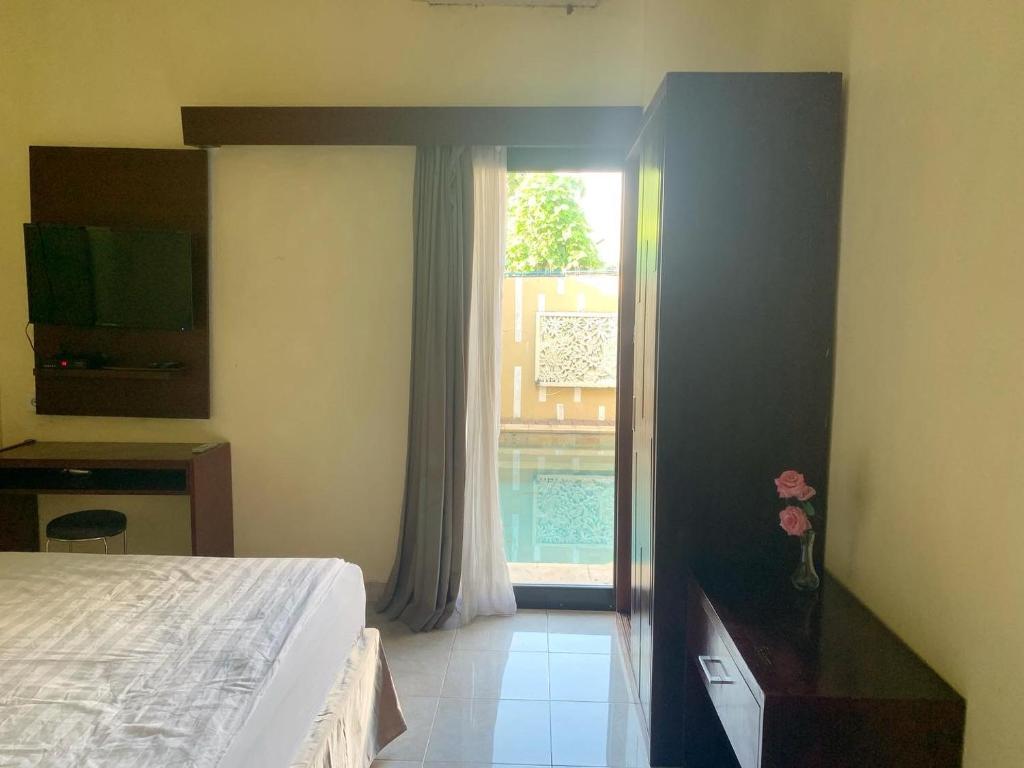 Postel nebo postele na pokoji v ubytování Cozy Palm Villa