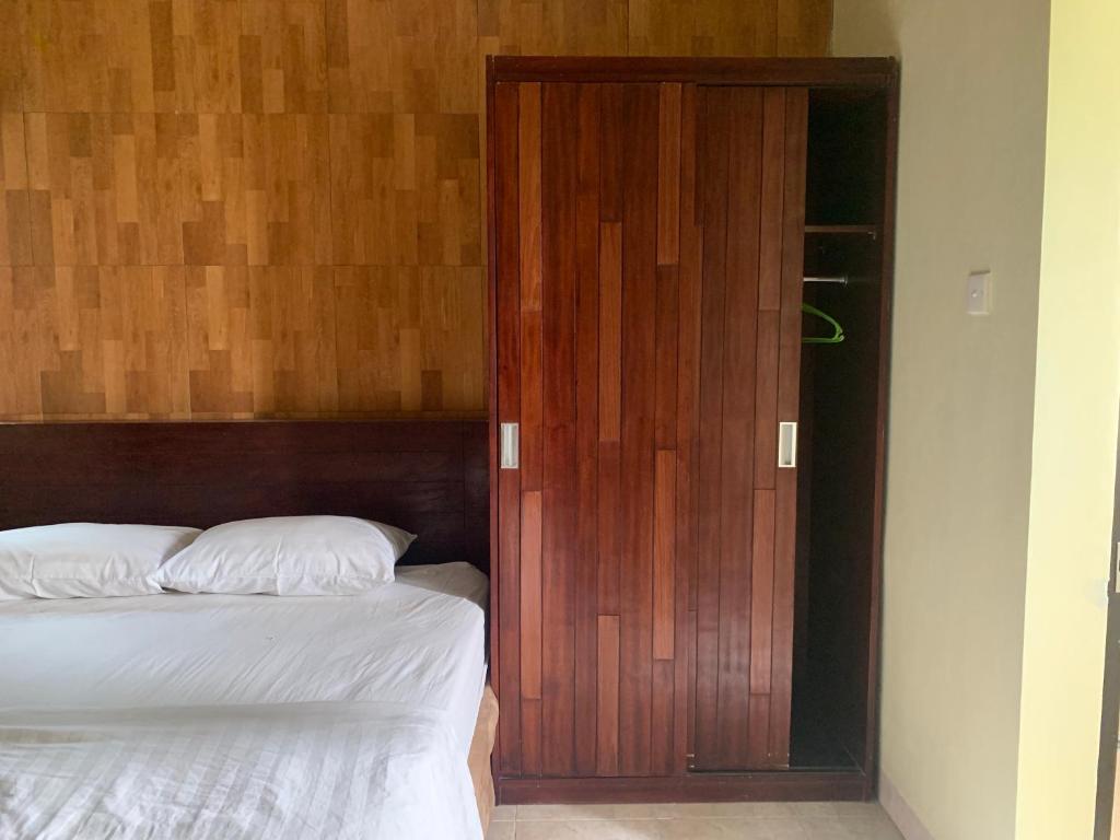 Postel nebo postele na pokoji v ubytování Cozy Palm Villa
