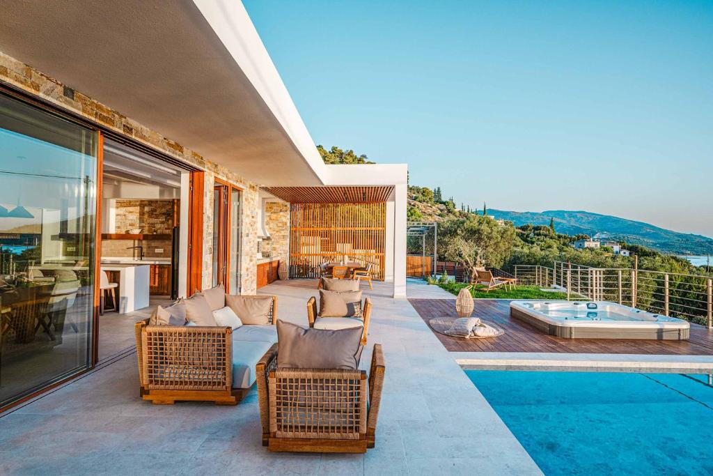 a house with a patio and a swimming pool at Alba Thesan in Marathias