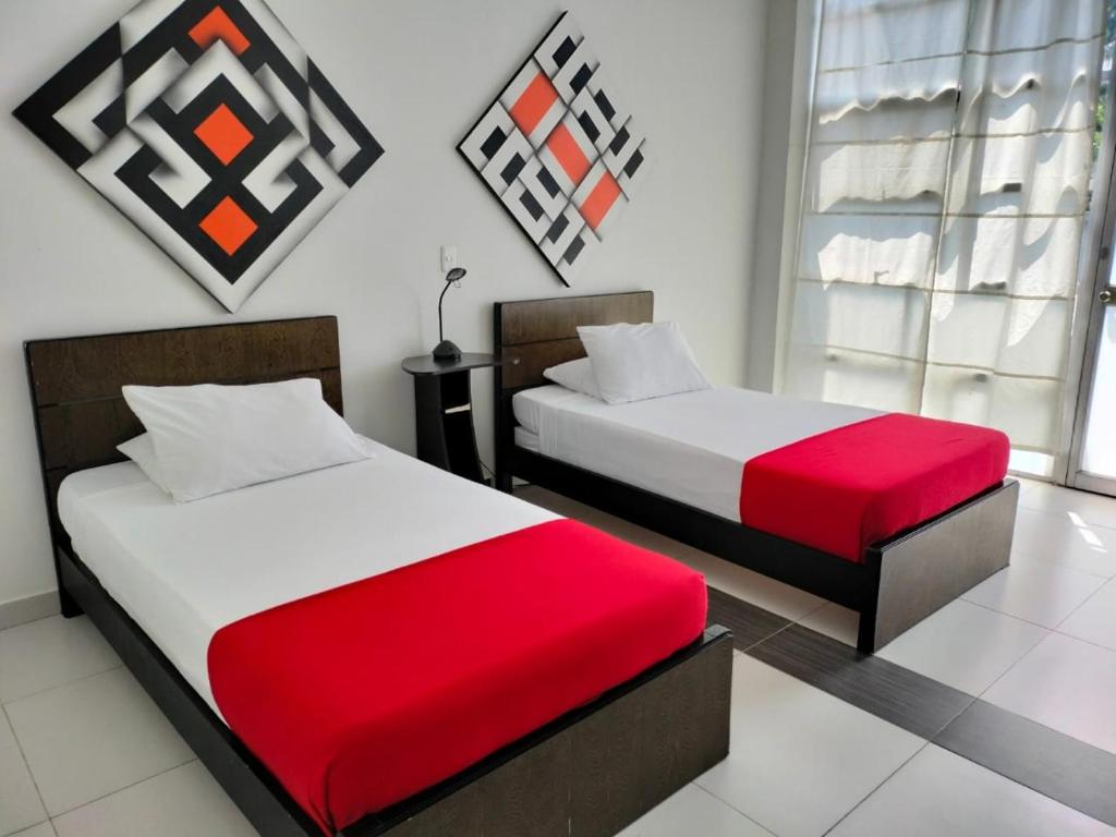 Katil atau katil-katil dalam bilik di Hotel Torre del Viento cali