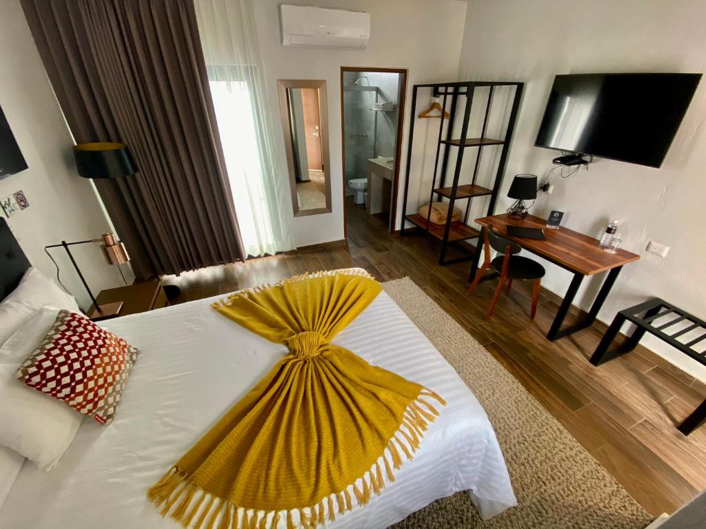 Postel nebo postele na pokoji v ubytování HOTEL MINA REAL