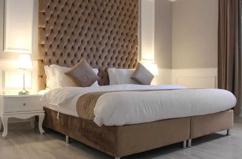 Ένα ή περισσότερα κρεβάτια σε δωμάτιο στο الماطر للشقق الفندقية Almater Hotel Suites