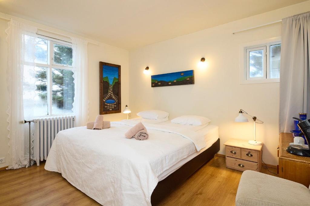 Postel nebo postele na pokoji v ubytování Englendingavík Homestay