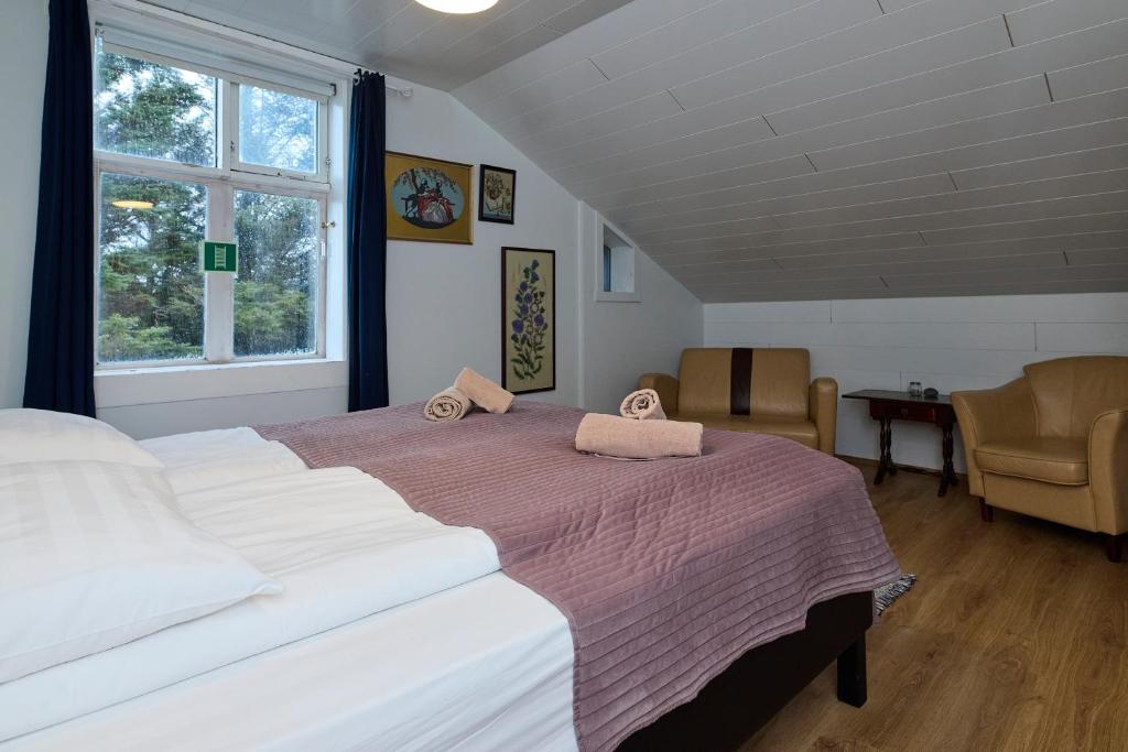 Postel nebo postele na pokoji v ubytování Englendingavík Homestay