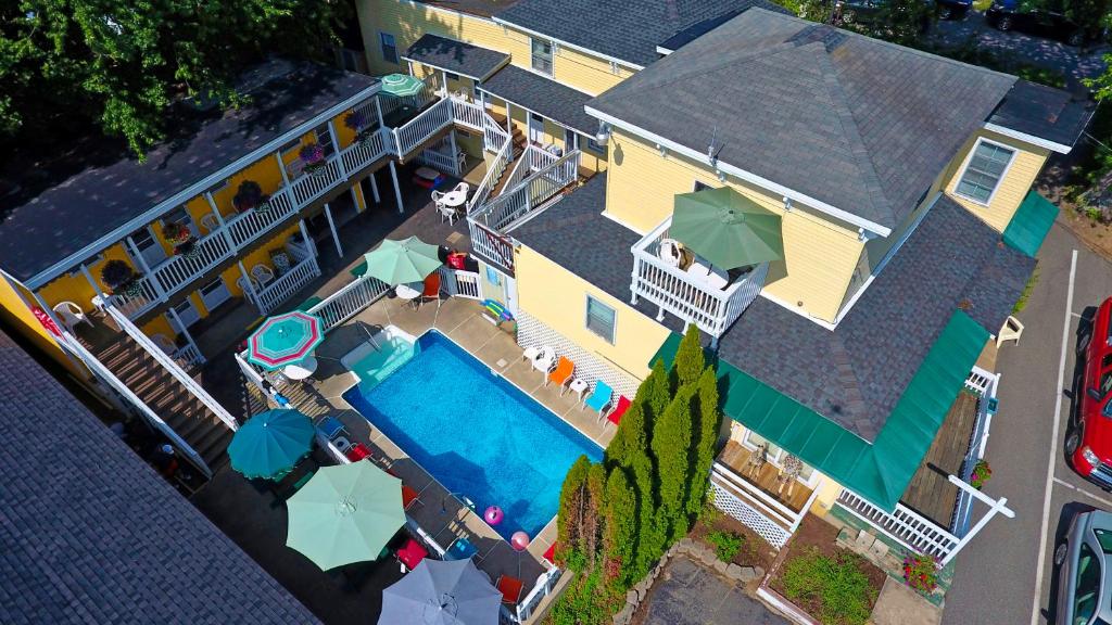 an overhead view of a house with a swimming pool at Beach Motel and Suites in Old Orchard Beach