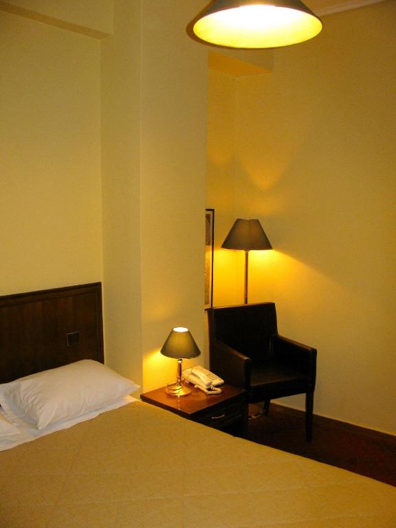 Postel nebo postele na pokoji v ubytování Nicola Hotel