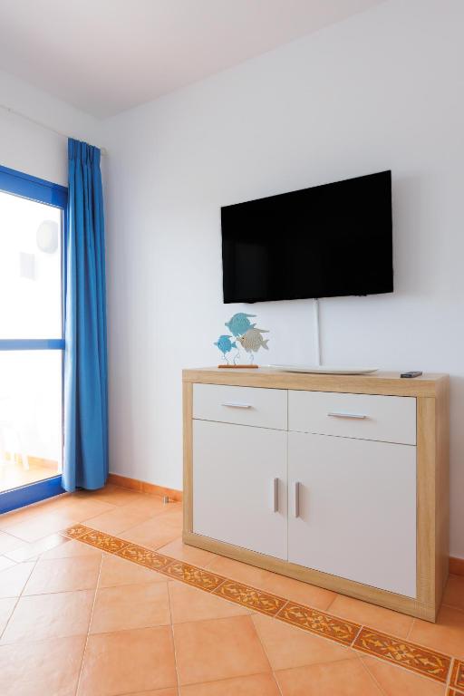 TV a/nebo společenská místnost v ubytování Astarita SUN