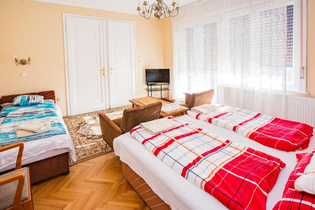 Postel nebo postele na pokoji v ubytování Mohacsi Guesthouse