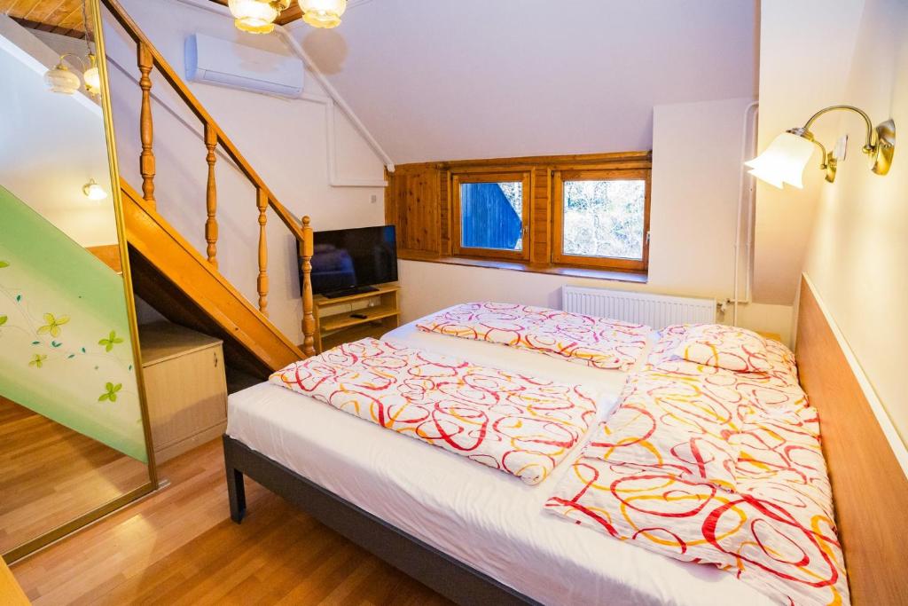 Postel nebo postele na pokoji v ubytování Mohacsi Guesthouse