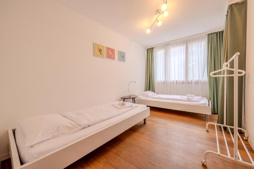 Posteľ alebo postele v izbe v ubytovaní Chalet Apartments Iseltwald