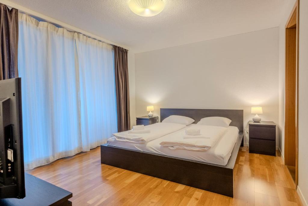 Posteľ alebo postele v izbe v ubytovaní Chalet Apartments Iseltwald